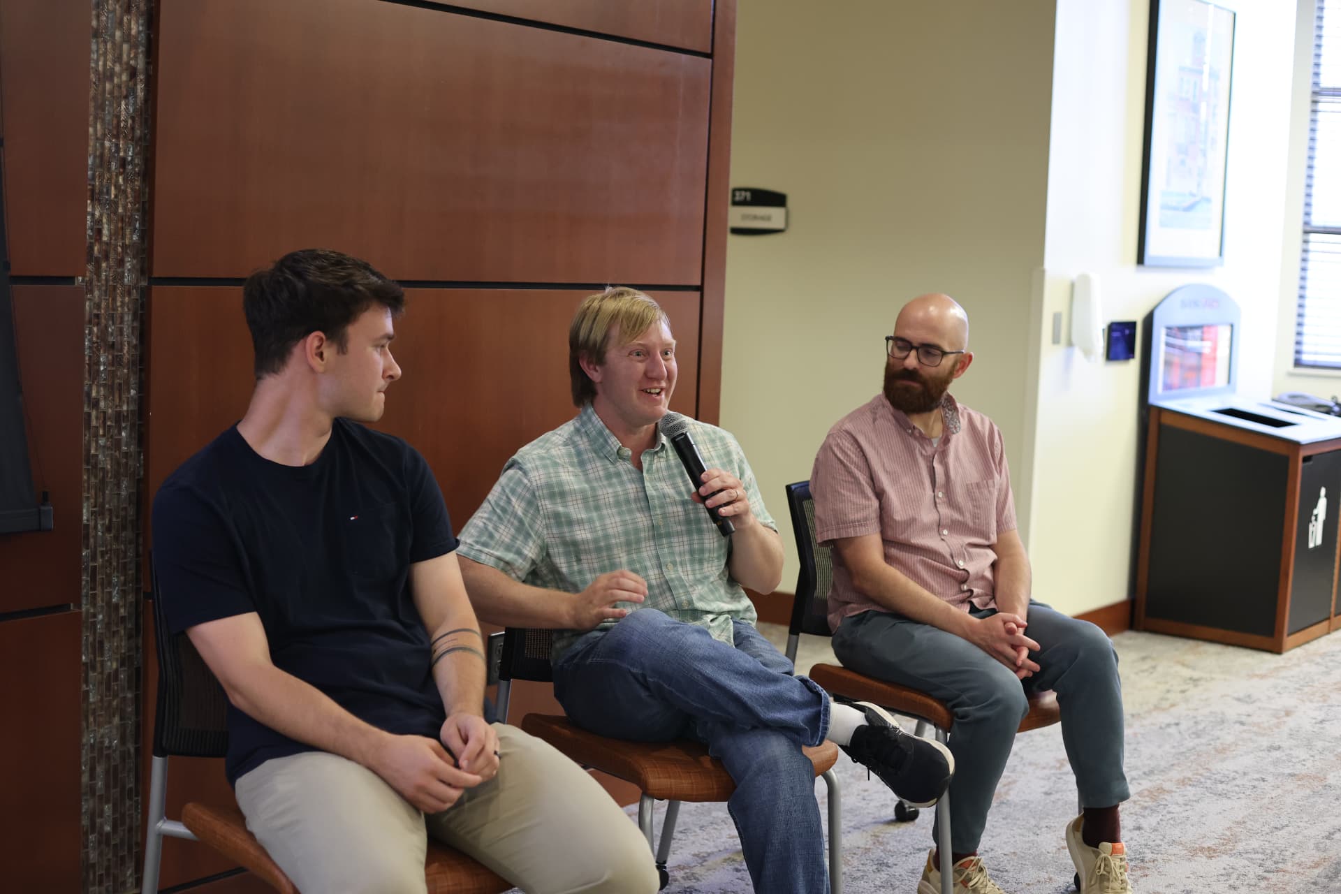 Three panelists in conversation at an AI in Fort Wayne event
